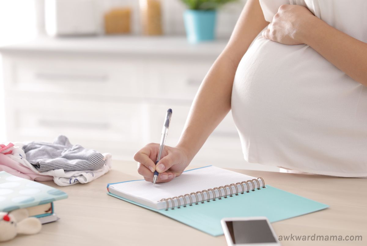Pregnant woman writing a list.