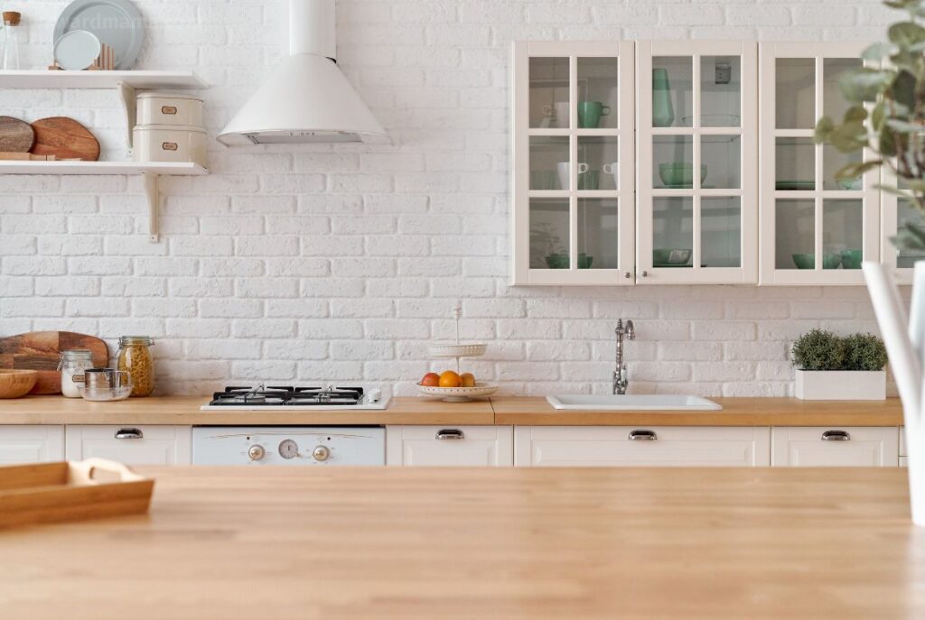 Bright kitchen table with coffee, breakfast, and open planner for simple routines for moms