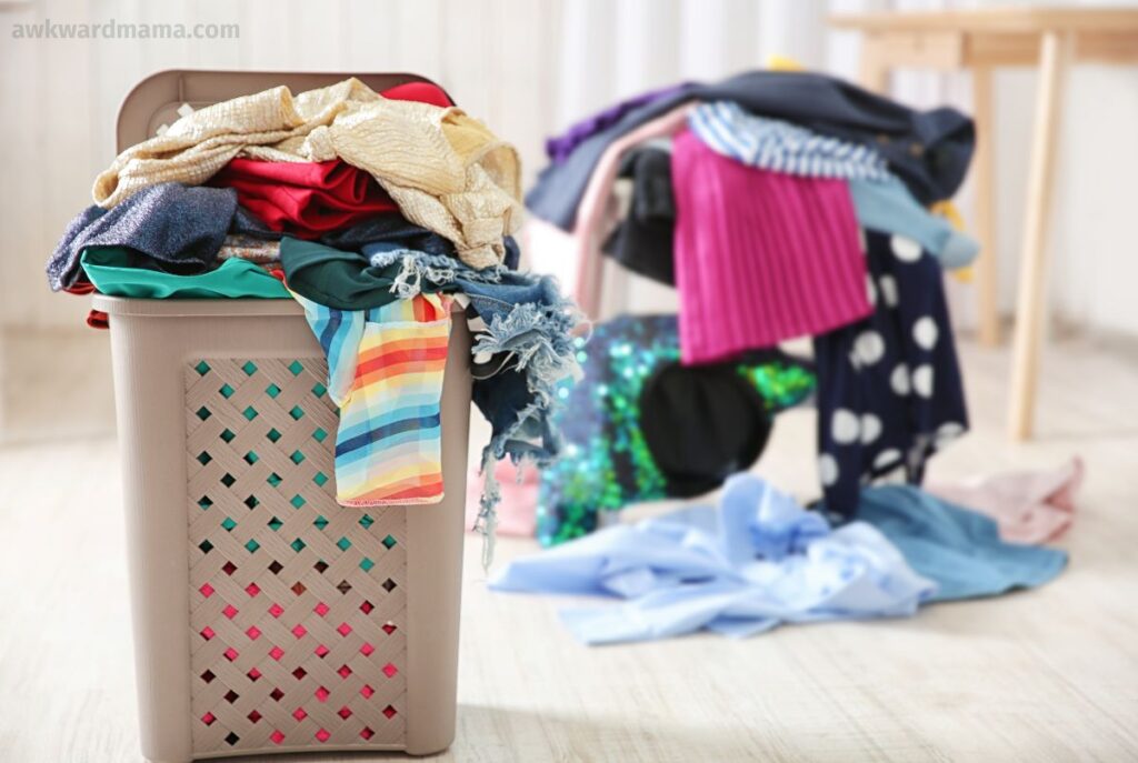 Laundry basket filled with clean clothes ready to be put away in a simple laundry routine