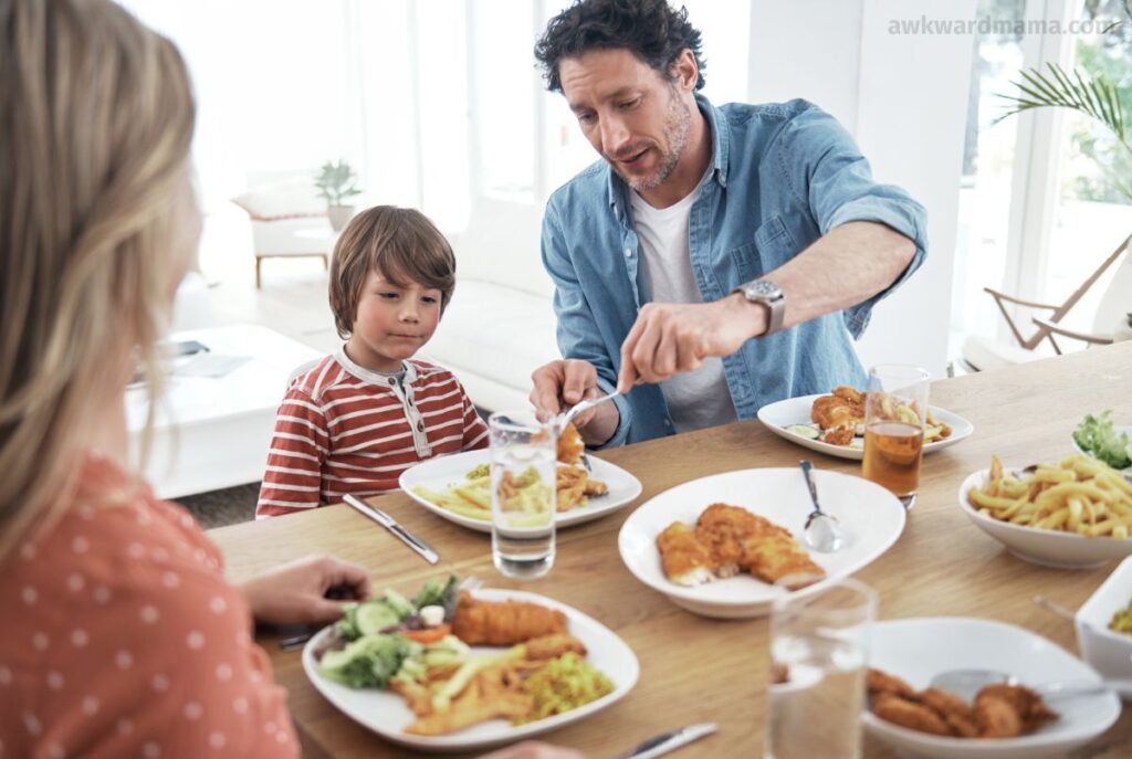 Family sitting together at the dinner table enjoying a simple weeknight meal